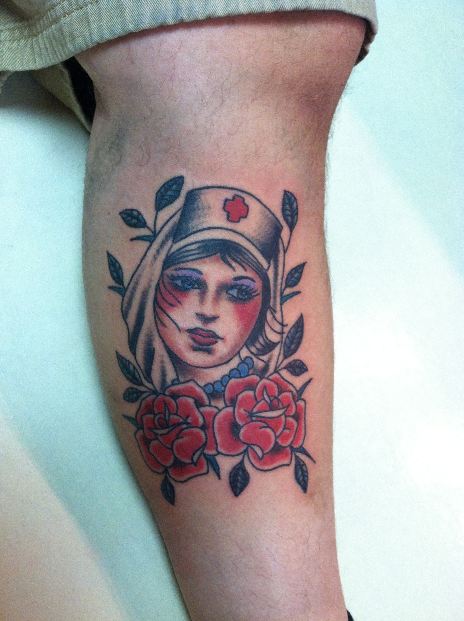 custom_traditonal_rose_of_no_mans_land_nurse_and_roses_tattoo_by_david_meek_tattoos_tucson_arizona