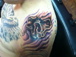 creepy skull tattoo on shoulder by david meek tattoos