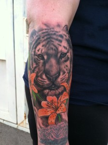 Custom photo realistic black and grey tiger arm tattoo by David Meek at fast lane tattoo tucson arizona bishop rotary eternal ink kingpin tattoo supply