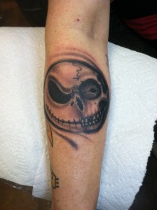 Custom black and grey jack skellington skull morph arm tattoo by david meek at fast lane tattoo tucson arizona