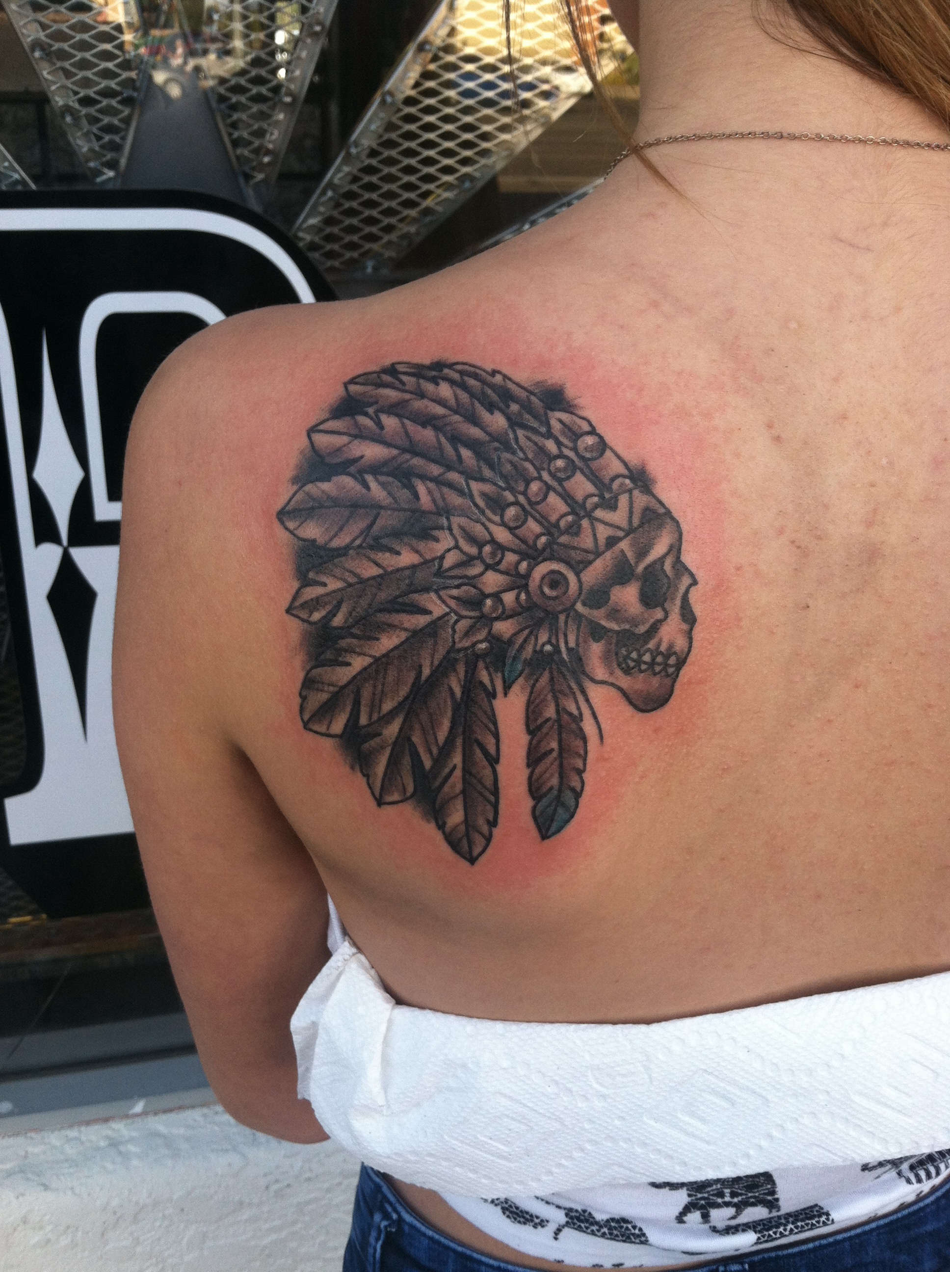 Custom black and grey skull with headdress native girl back tattoo by david meek of fast lane tattoo in tucson arizona with kingpin tattoo supply