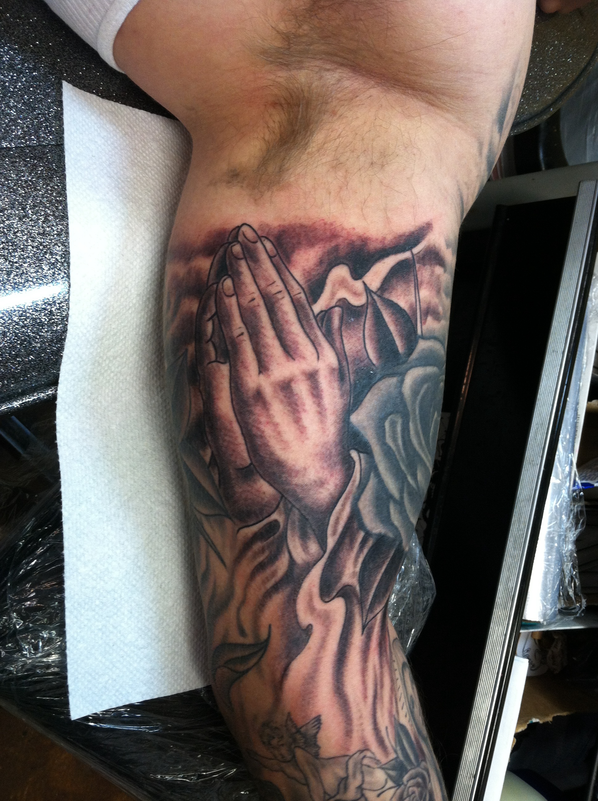 custom traditional black and grey inner arm traditional praying hands religious sleeve tattoo by david meek in tucson arizona at fast lane tattoo with kingpin tattoo supply