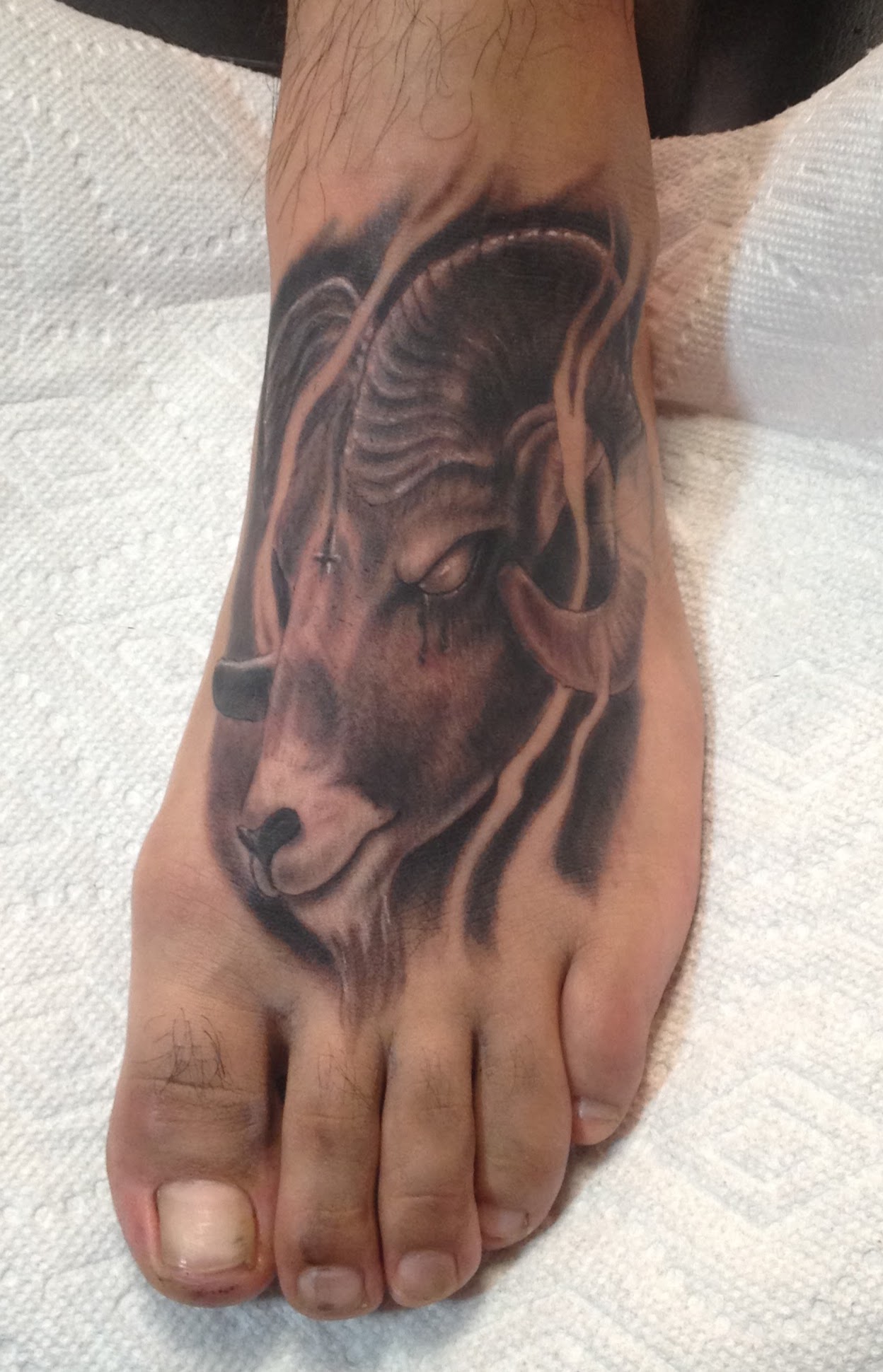 Realistic_satanic_goat_ram_black_and_grey_realism_foot_feet_tattoo_David_Meek_tattoo_artist_best_tucson_arizona_fast_lane_tattoo_shop_alicante_barcelona_spain_tatuajes_mediterranean