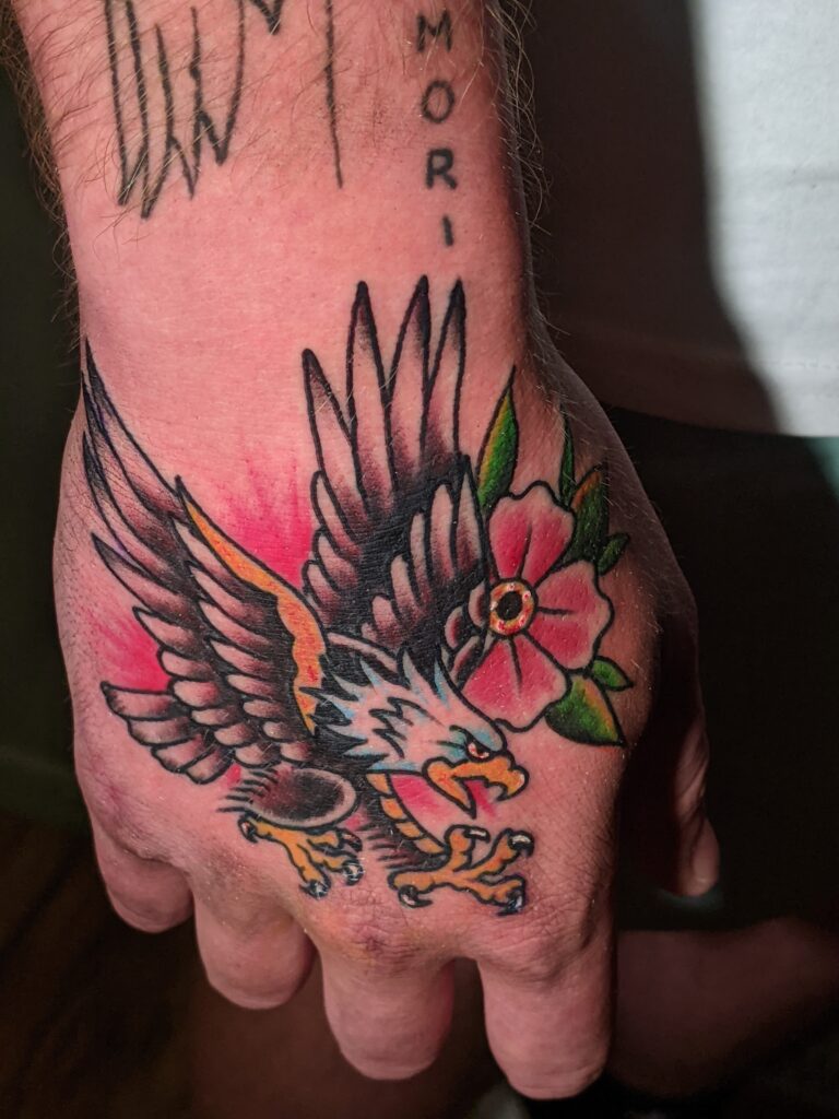 American Traditional Eagle tattoo on a hand by David Meek of Art and Sol Tattoo in Tucson Arizona