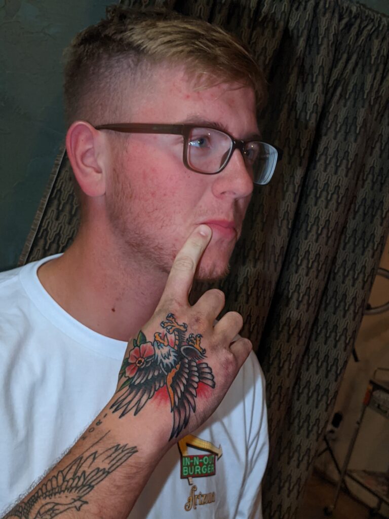 United States Sailor with American Traditional Eagle Tattoo on his hand by David Meek of Art and Sol Tattoo in Tucson Arizona